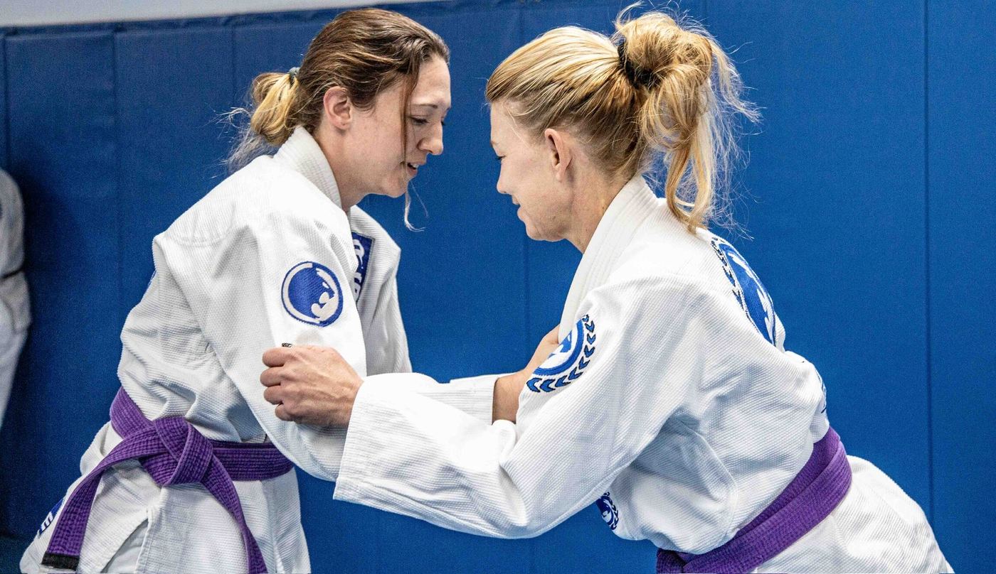 Two women training jiu jitsu in the gi at Renzo Gracie Naples
